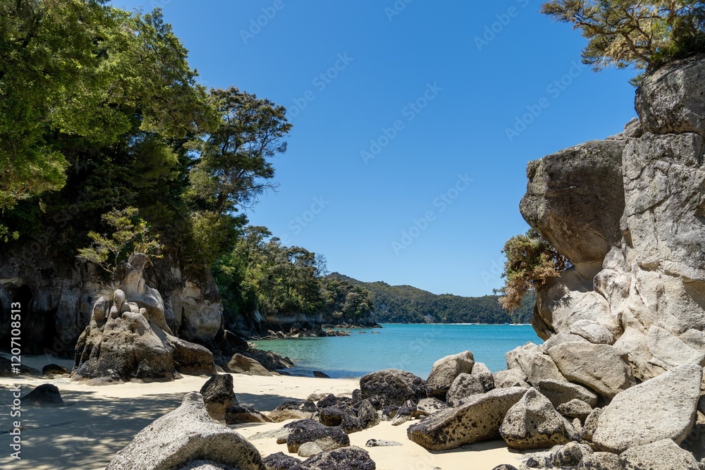 Rocky beach with turquoise water and greenery. Rocky beach with turquoise water and greenery.