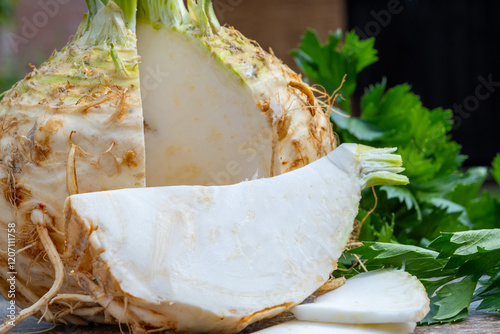 Celery root - celeriac, source of vitamins, fresh healthy vegetable, wedge photo