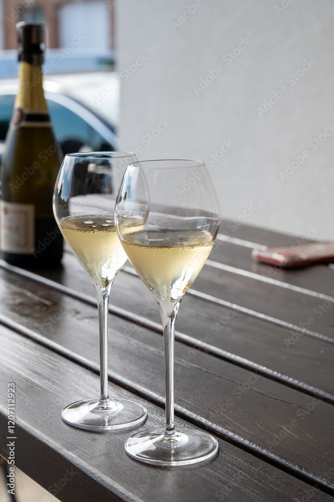 Obraz premium Tasting of brut and reserve grand cru champagne sparkling wine produced by traditional method in Mesnil-sur-Oger in Champagne, France