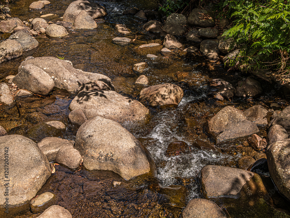 Water Trickles Between Rounded Rocks Water Trickles Between Rounded Rocks