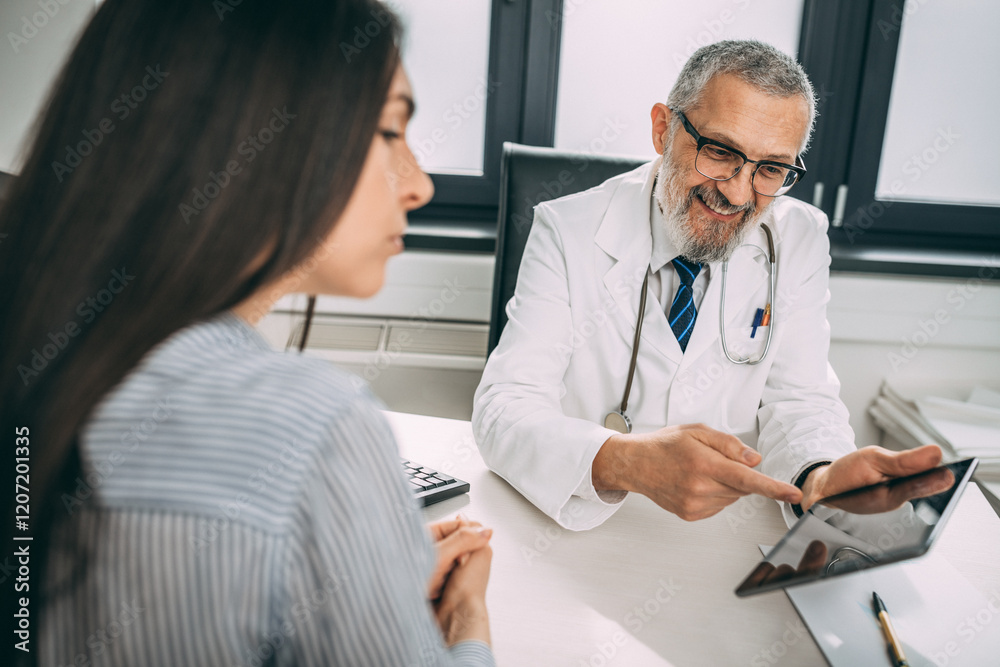 Every patient should have a clear understanding of their diagnostic. Shot of a handsome doctor going over some paperwork with a female young patient in a clinic. Every patient should have a clear understanding of their diagnostic. Shot of a handsome doctor going over some paperwork with a female young patient in a clinic.