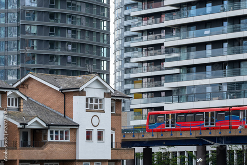 This image illustrates a vibrant urban landscape where contemporary high-rise buildings meet traditional architecture, emphasizing the dynamic nature of city life and transportation. photo