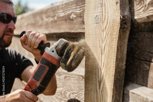 Rough cleaning and blanching of old boards - renovation of garden fence slats - rough male labor