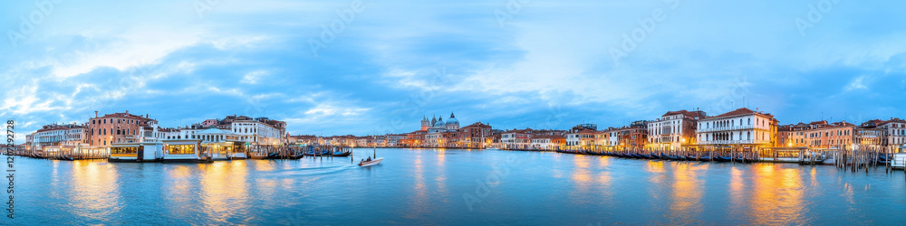 Panoramic view of Venice canals at twilight with glowing city lights Panoramic view of Venice canals at twilight with glowing city lights