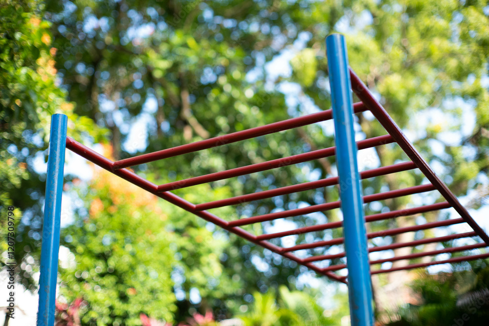 A monkey bar exercise equipment in an outdoor park ready for use A monkey bar exercise equipment in an outdoor park ready for use
