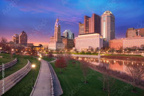 Obraz na płótnie Columbus, Ohio, USA. Cityscape image of Columbus, Ohio, USA downtown skyline with the reflection of the city in the Scioto River at spring sunset. w salonie