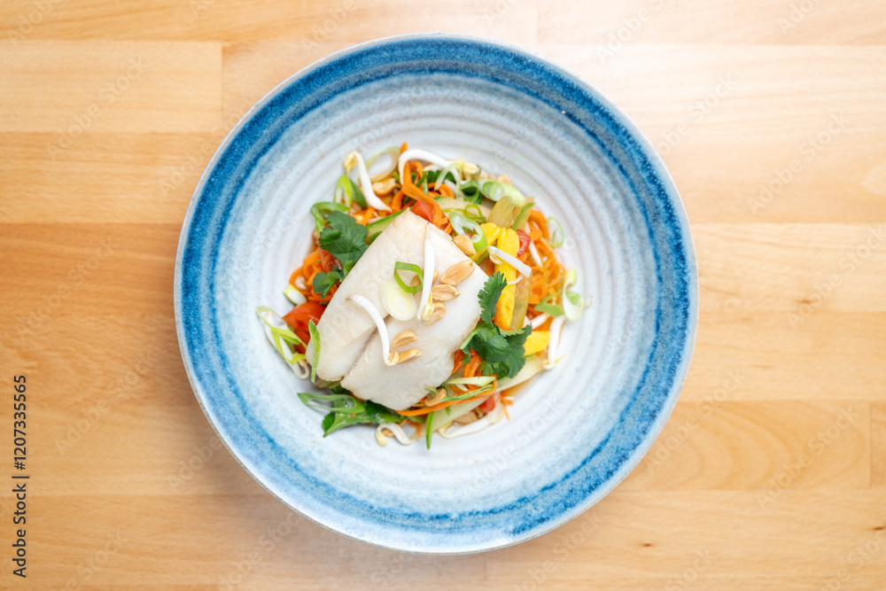 modern restaurant dish white cod fish fillet on fresh steamed vegetable light lunch bowl