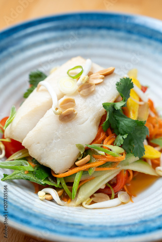 Obraz na płótnie modern restaurant dish white cod fish fillet on fresh steamed vegetable light lunch bowl w salonie