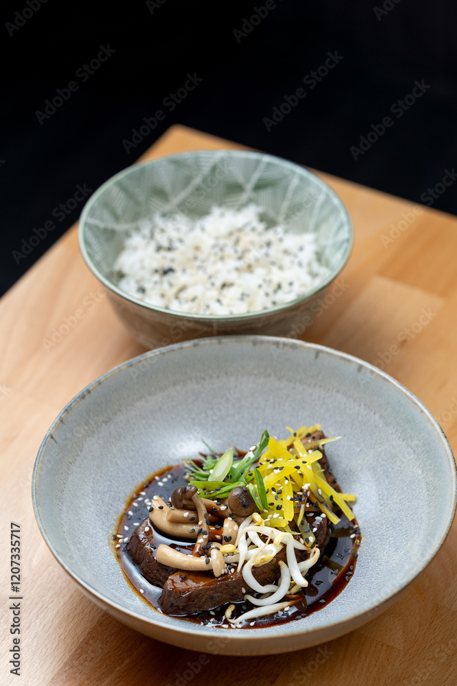 modern cooking restaurant beef cheeks fillet stew mushroom shitake chilli garnish brown sauce bowl wooden table detail modern cooking restaurant beef cheeks fillet stew mushroom shitake chilli garnish brown sauce bowl wooden table detail