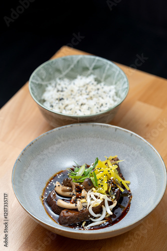 Obraz na płótnie modern cooking restaurant beef cheeks fillet stew mushroom shitake chilli garnish brown sauce bowl wooden table detail w salonie