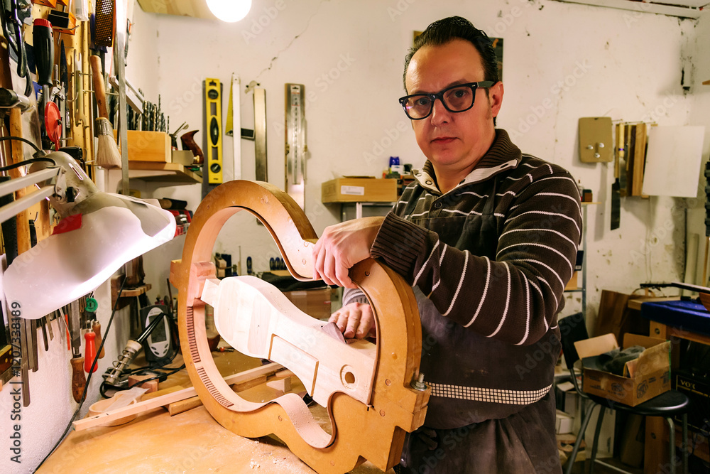 © ADDICTIVE STOCK - Crafting bass guitars in a detailed luthier workshop setting © ADDICTIVE STOCK - Crafting bass guitars in a detailed luthier workshop setting