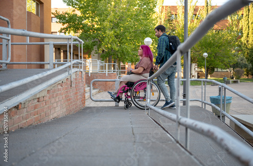 College couple navigating campus with wheelchair access