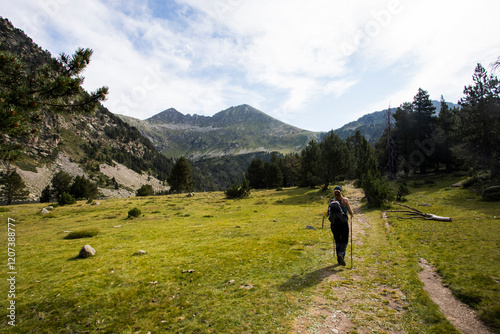 Young hiker woman in Vall de Boi, Aiguestortes and Sant Maurici National Park, Spain photo