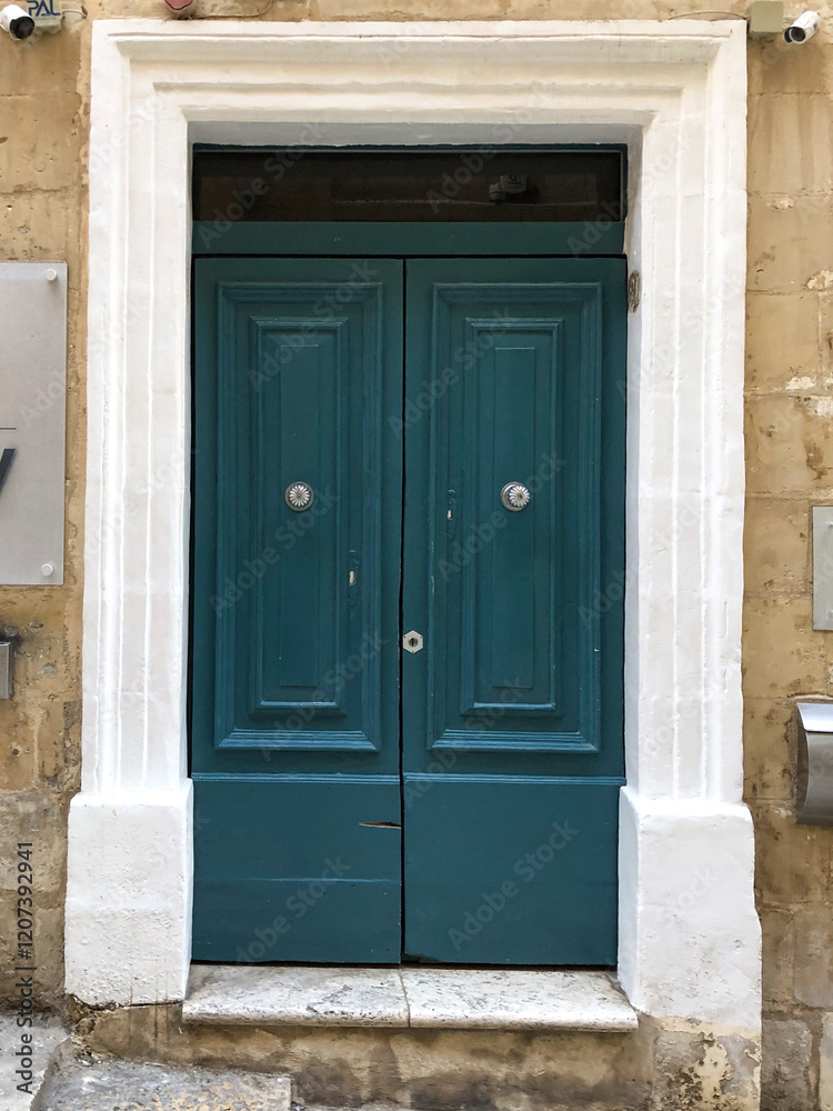 Turquoise blue green Maltese Wooden and Metal Door - charming blue wooden door found in Malta, reflecting the island’s rich cultural heritage and classic design, ornaments, black knob Turquoise blue green Maltese Wooden and Metal Door - charming blue wooden door found in Malta, reflecting the island’s rich cultural heritage and classic design, ornaments, black knob