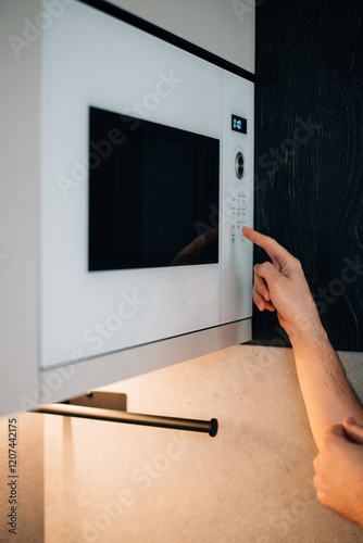 turning on the microwave oven
