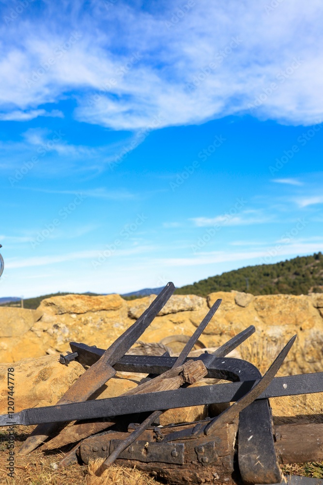 Rusty farm tools with blue sky Rusty farm tools with blue sky