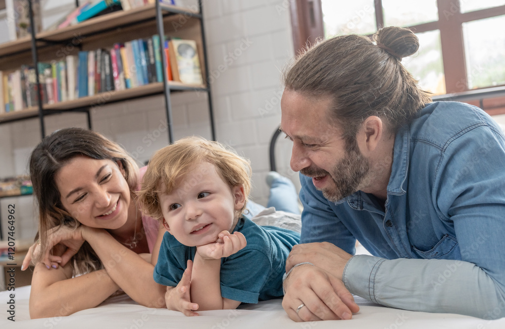 Family enjoys quality time together indoors in a cozy setting while engaging with a child Family enjoys quality time together indoors in a cozy setting while engaging with a child