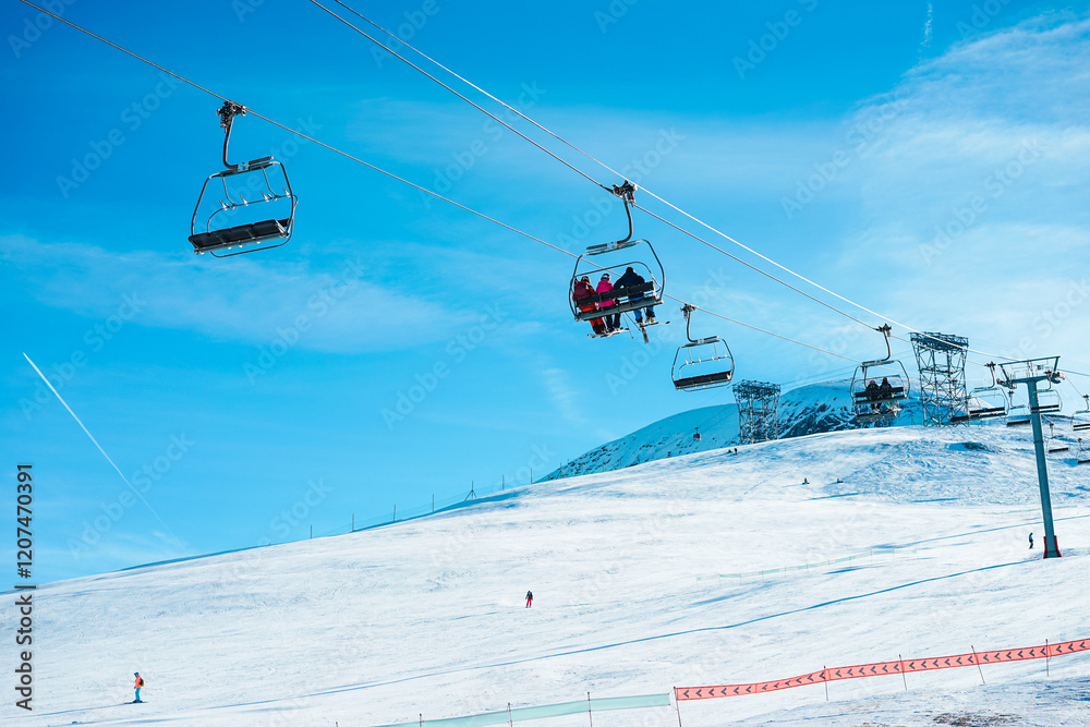 People on ski lift in winter sport resort - Travel and vacation concept - Focus on center cable cabin People on ski lift in winter sport resort - Travel and vacation concept - Focus on center cable cabin