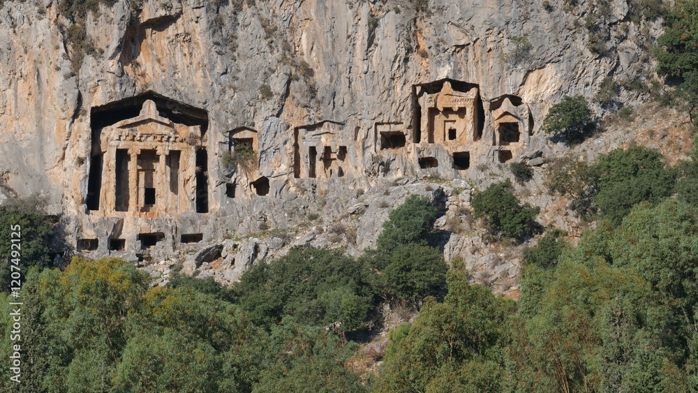 Fototapeta premium ancient rock tombs next to dalyan river historic lycian graves kaunos fethiye turkey