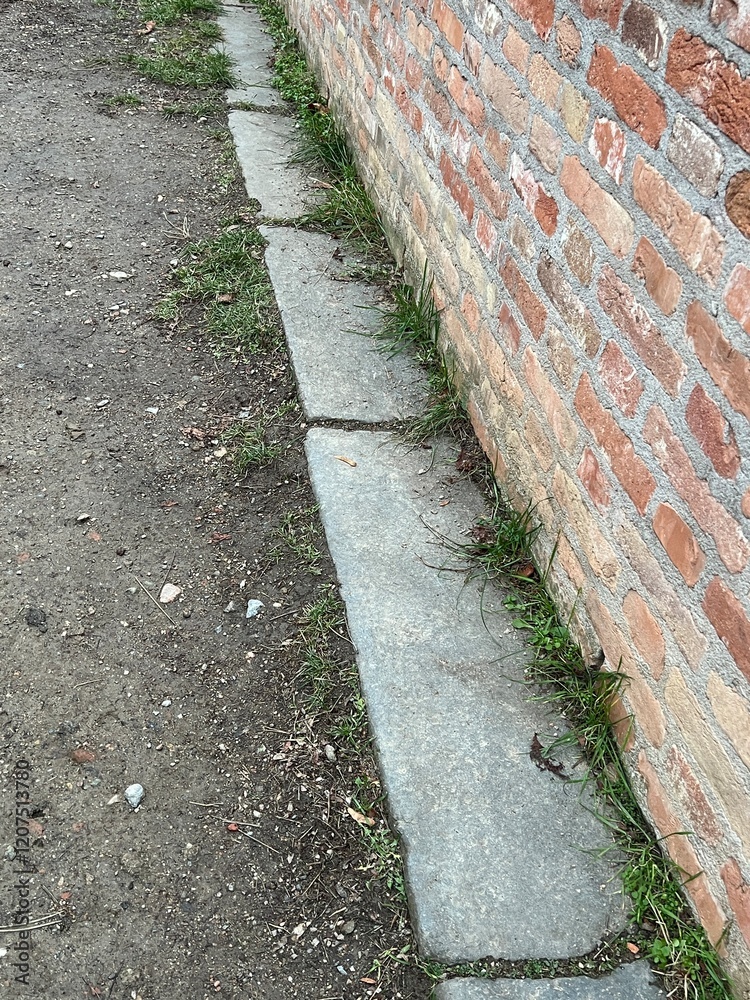 Brick wall with a stone footer Brick wall with a stone footer