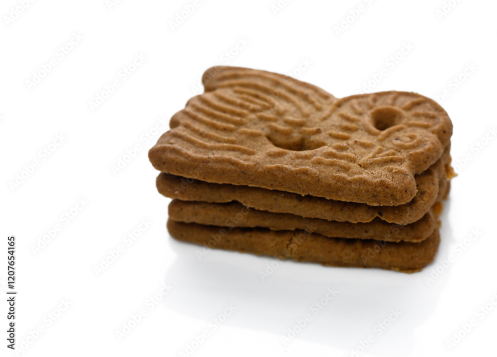 Delicious gingerbread cookies stacked artistically on a clean surface ready to be enjoyed Delicious gingerbread cookies stacked artistically on a clean surface ready to be enjoyed