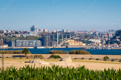 The Arrábida bridge as seen from Douro Estuary nature reserve in Porto, Portugal photo