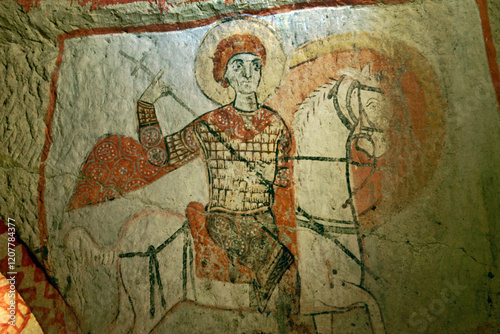 Early Christian mural. Saint George slaying dragon in rock carved Saint Basils Church. Goreme National Park, Cappadocia Turkey