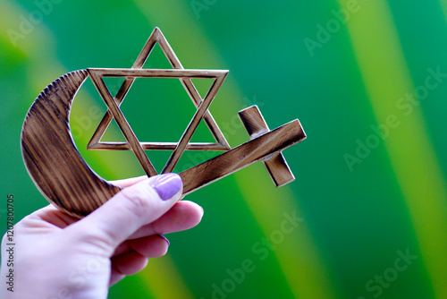 Religious symbols of interfaith dialogue concept, Jewish Star of David, Muslim Crescent, Christian Cross, Indonesia photo