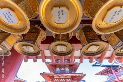 View of corridor surounding the courtyard at Shitenno-ji Gojunoto Temple on a sunny day, Shitennoji, Tennoji Ward, Osaka, Honshu, Japan photo