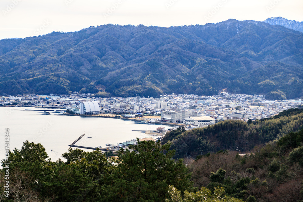 Coastal Cityscape with Mountains and Harbor View Coastal Cityscape with Mountains and Harbor View