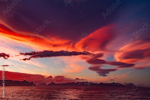 Interesting lenticular cloud formations forming over the island of South Georgia at sunset in the Southern Ocean