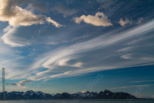 Interesting lenticular cloud formations forming over the island of South Georgia in the Southern Ocean photo