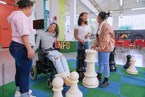 Children playing large scale chess at science center