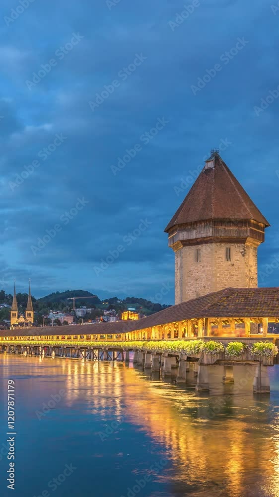 Lucerne (Luzern) Switzerland time lapse day to night city skyline at Chapel Bridge (Vertical) Lucerne (Luzern) Switzerland time lapse day to night city skyline at Chapel Bridge (Vertical)