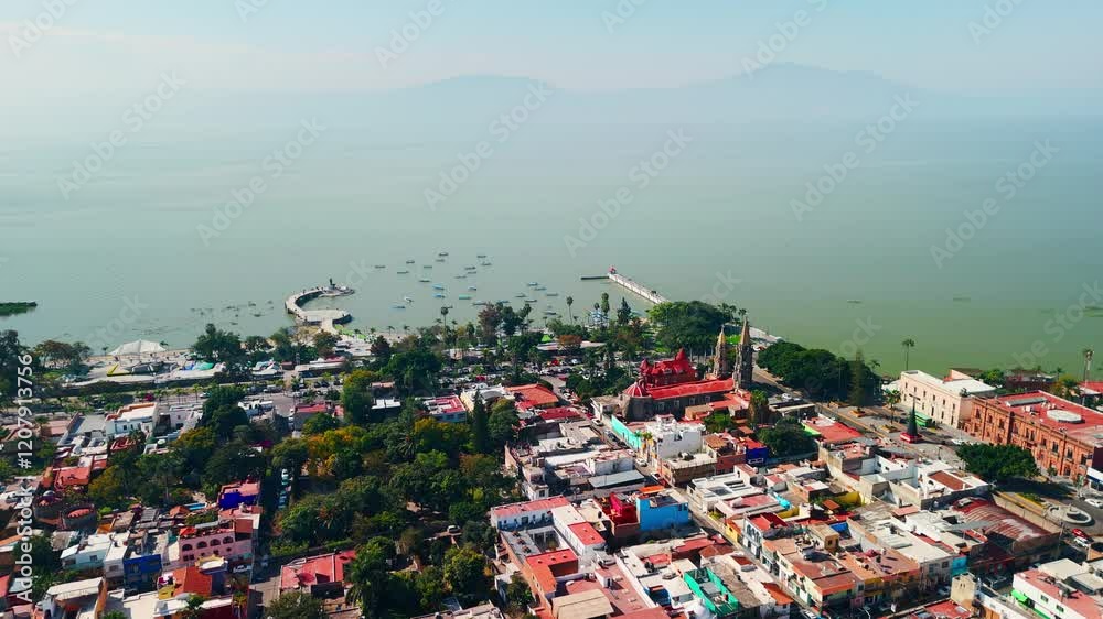 Chapala town and lake in Jalisco, Mexico, featuring church, pier and boats Chapala town and lake in Jalisco, Mexico, featuring church, pier and boats