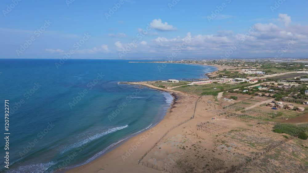 Aerial approaching view of the South coast of Sicily near Portopalo Aerial approaching view of the South coast of Sicily near Portopalo