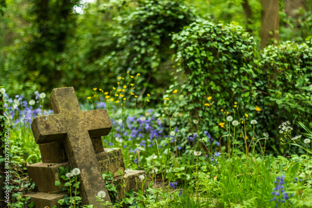 Old Cross Gravestone Surrounded by Wildflowers in Lush Green Cemetery Old Cross Gravestone Surrounded by Wildflowers in Lush Green Cemetery