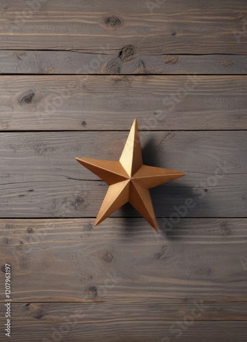 Bronze star on a wooden surface against a subtle gray background, abstract shape, shiny photo