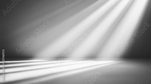 Soft light rays illuminating a minimalist space in black and white