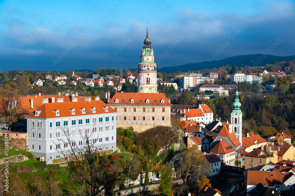 Fototapeta premium Panoramic view of Cesky Krumlov, showcasing the UNESCO-listed historic center surrounded by the Vltava River in a meander. A sunny autumn day highlights the town's charm.