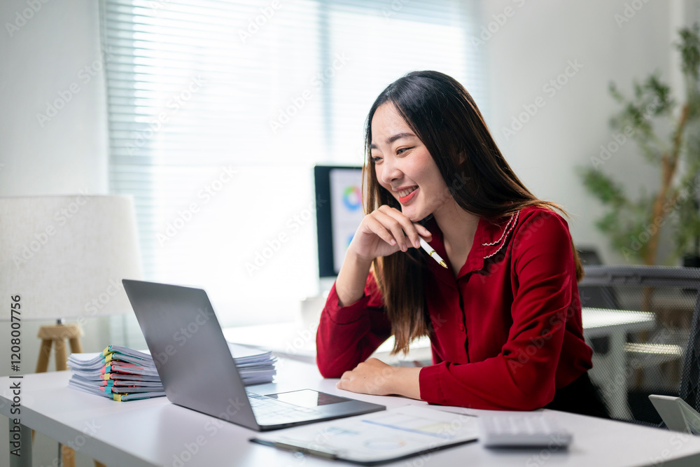 A woman is sitting at a desk with a laptop and a stack of papers A woman is sitting at a desk with a laptop and a stack of papers
