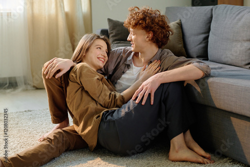 Принти на полотні Red haired man joking and admiring his lovely wife while she laughing out loud i