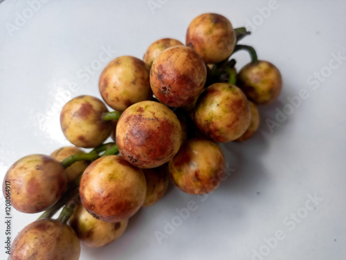 Kepundung or rambai fruits (Baccaurea racemosa or ramiflora or motleyana), isolated on white background. photo