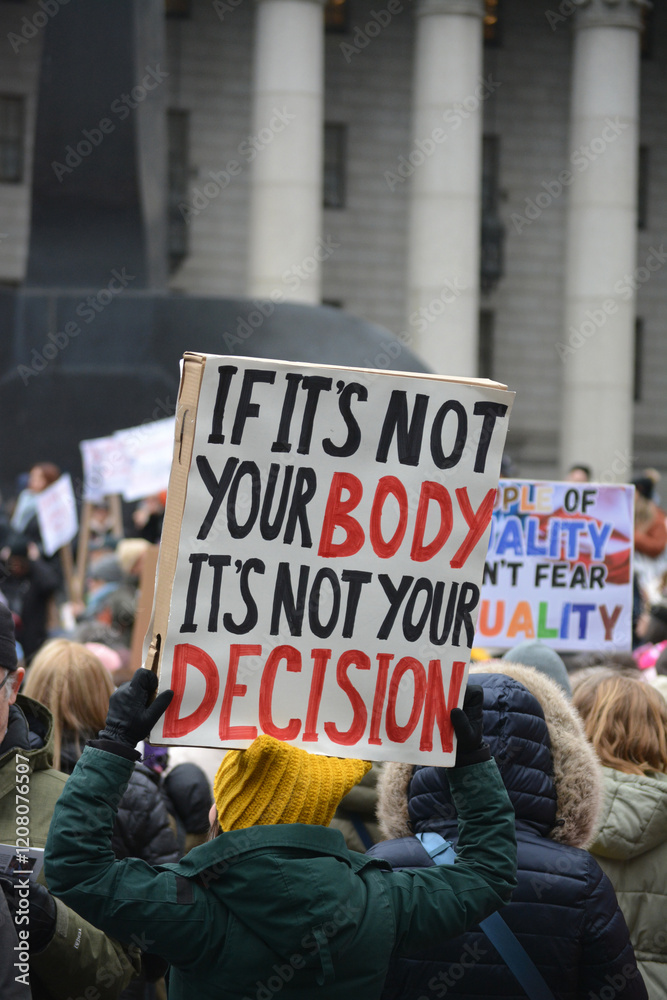 Person holding a sign at the 2025 People's March in New York City.