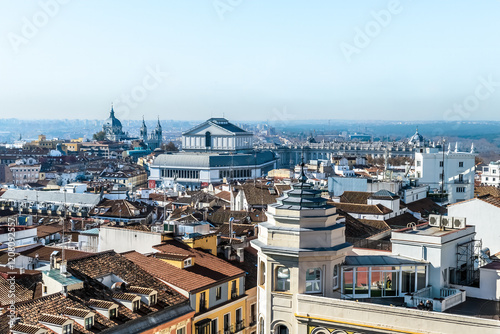 A panoramic view of Madrid showcasing the Royal Palace, Almudena Cathedral, and Teatro Real, Spain. Historic rooftops and key landmarks of the city in clear daylight. Madrid, Spain - November 30, 2021