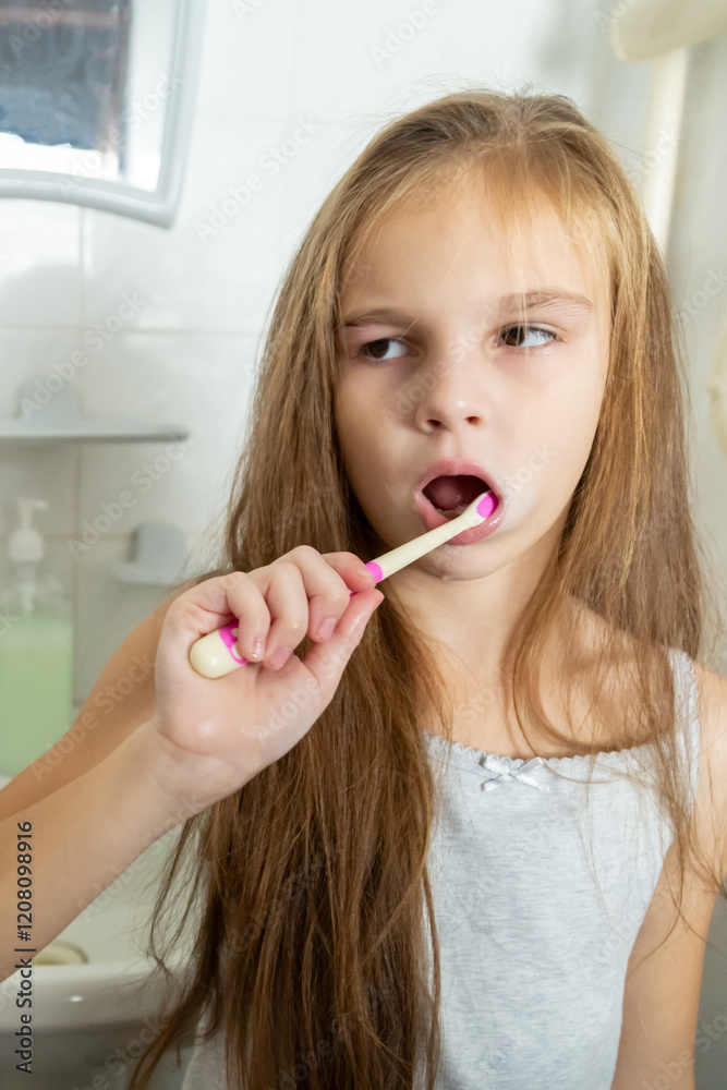 Portrait of child girl cleaning mouth with a toothbrush at bathroom Portrait of child girl cleaning mouth with a toothbrush at bathroom