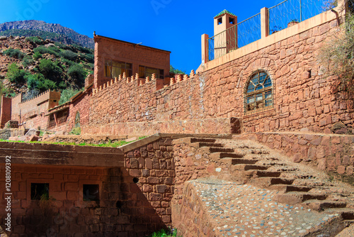 Morocco Atlas Mountains - Kasbah built in adobe overlooking a fertile valley. photo