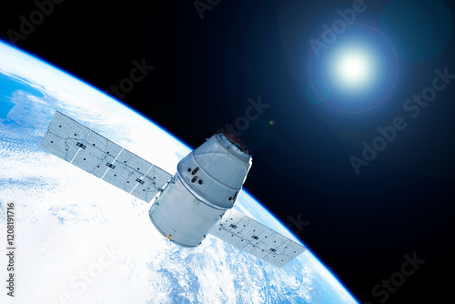 Fototapeta Naklejka Na Ścianę i Meble -  A space satellite above the Earth's surface. Elements of this image furnished by NASA