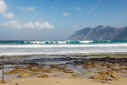 Obraz na płótnie The beach Playa at La Caleta de Famara. Lanzarote, Canary Islands. Looking to cliffs of Risco de Famara w salonie
