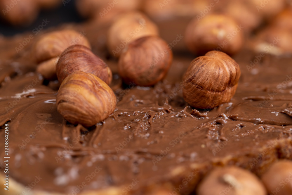 Fototapeta premium hazelnuts and bread with nut paste with chocolate